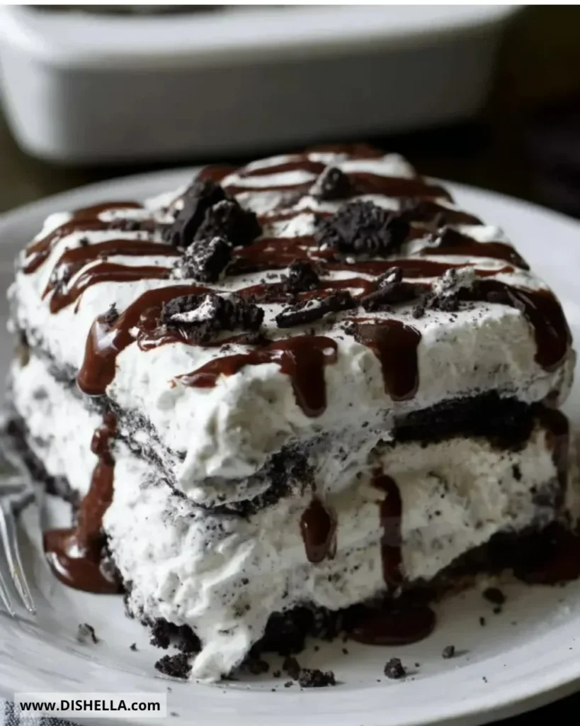 Oreo Icebox Cake with layers of chocolate and cream on a dessert plate