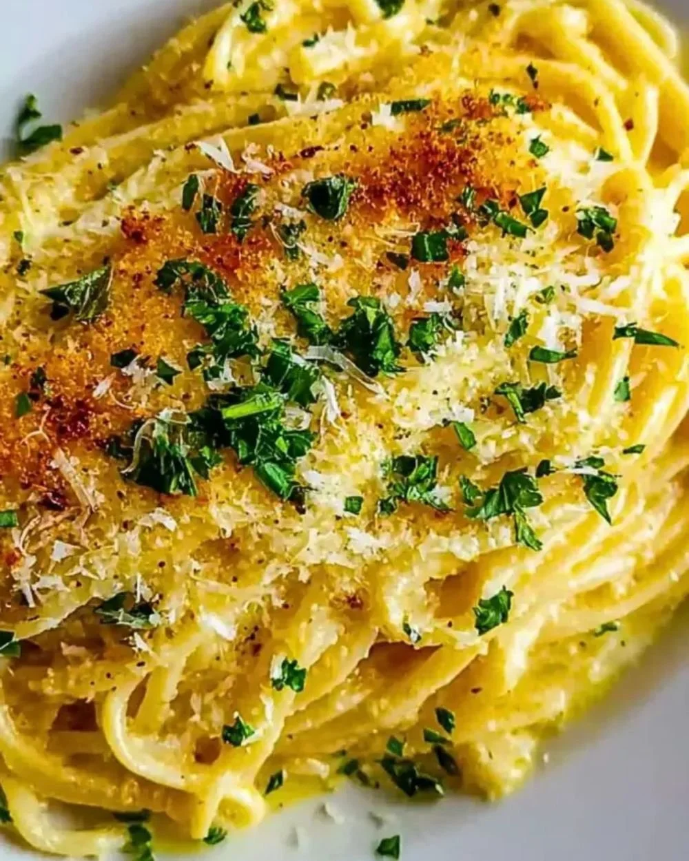 Delicious buttery garlic noodles topped with parmesan cheese.
