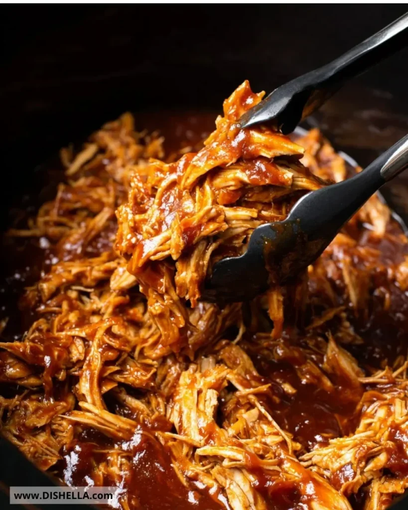 Delicious slow cooker BBQ pulled chicken served on a bun with slaw.