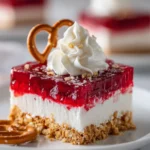 Holiday Cranberry Pretzel Salad with creamy layer and crushed pretzel topping