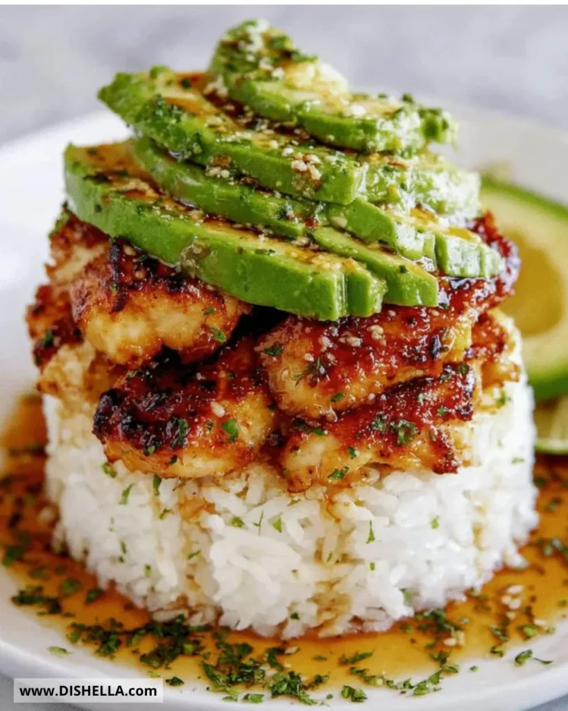 Plate of Honey Lime Chicken served with avocado rice stack.