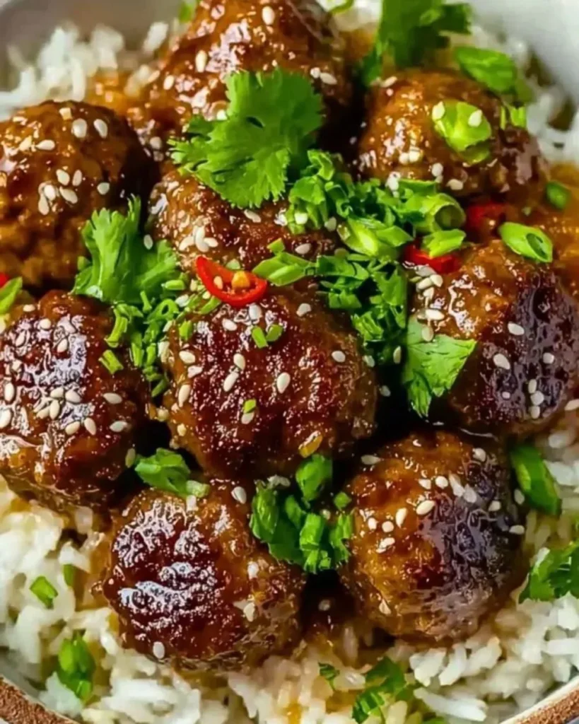 Delicious meatballs and rice bowl, perfectly seasoned and garnished.