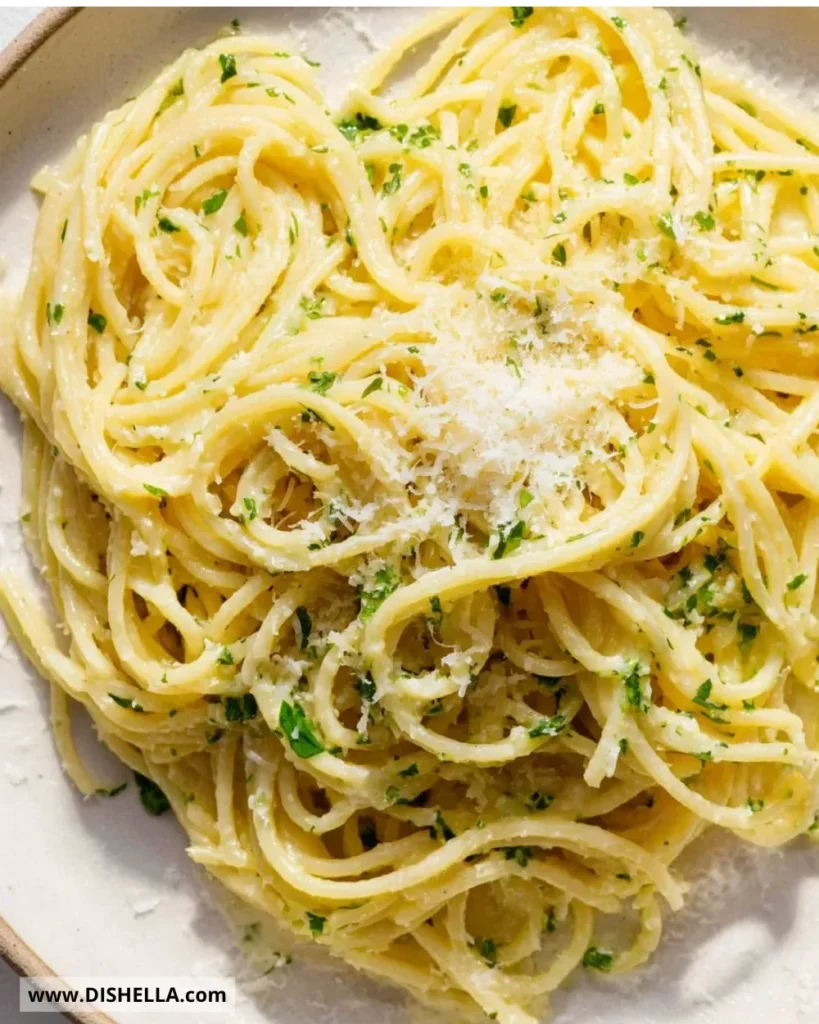 Plate of quick simple garlic butter pasta garnished with parsley