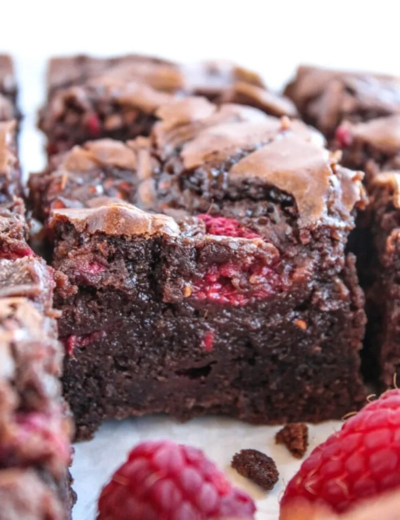 Delicious homemade raspberry brownies freshly baked with rich chocolate and tart raspberries.