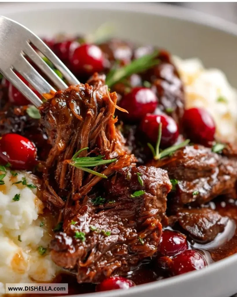Slow-braised beef roast with a cranberry balsamic glaze served on a plate