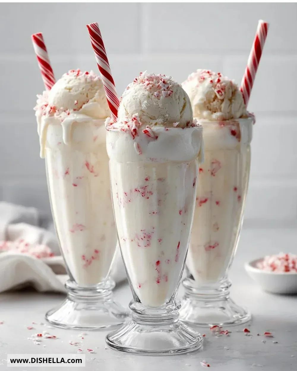Tasty peppermint Christmas float with festive toppings in a glass