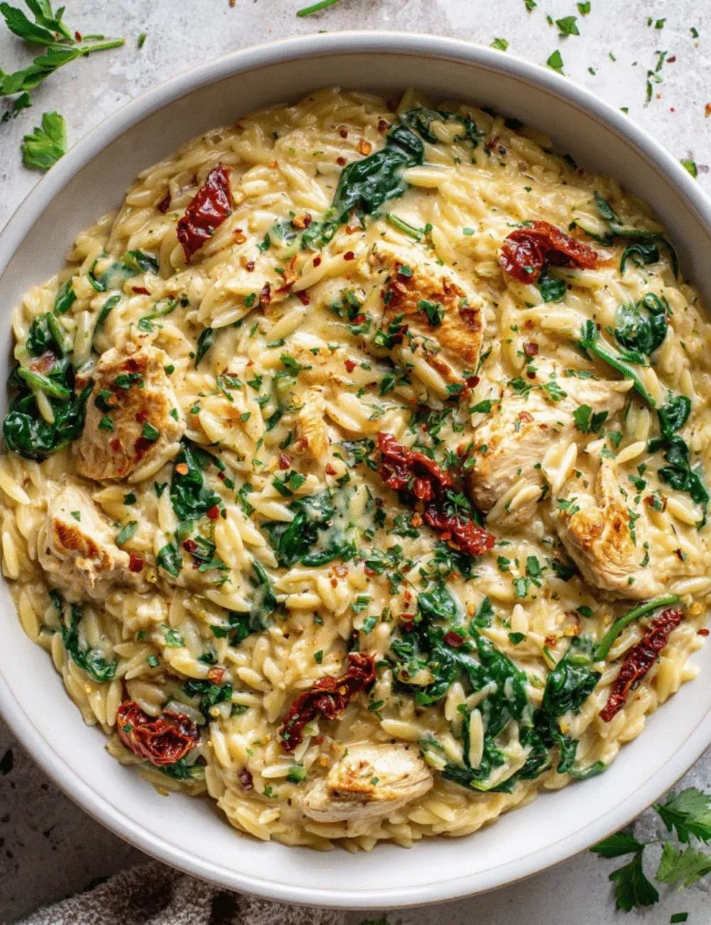 Creamy Tuscan Chicken Orzo dish served in a bowl