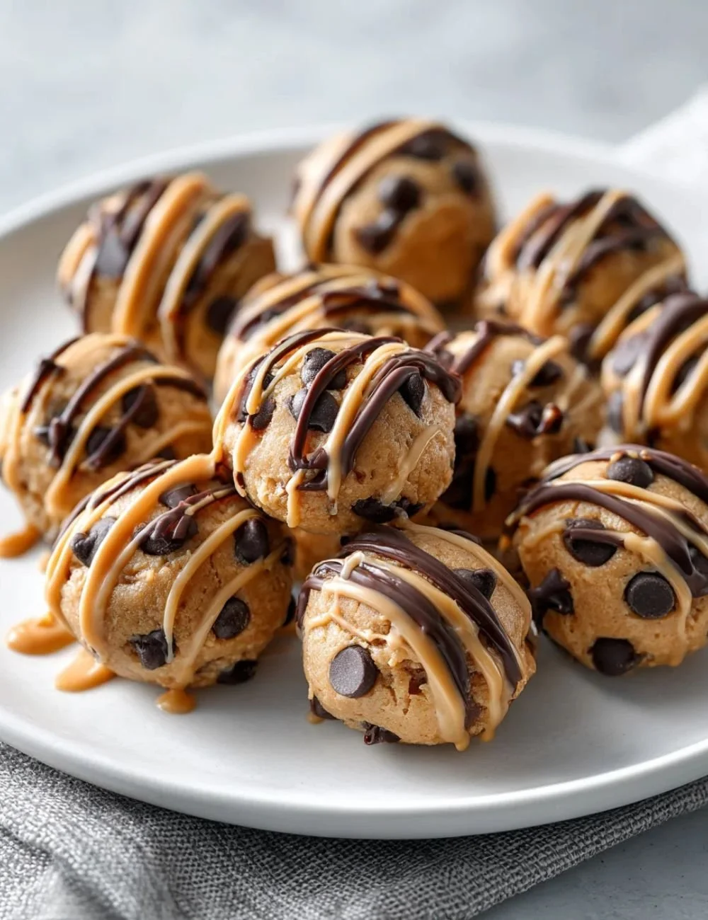 Frozen Greek yogurt peanut butter bites with chocolate chips on a plate