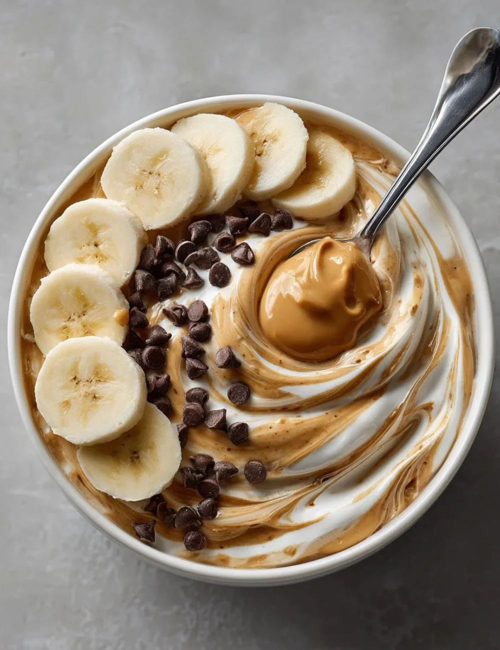 Peanut Butter Yogurt Bowl topped with fruits and nuts