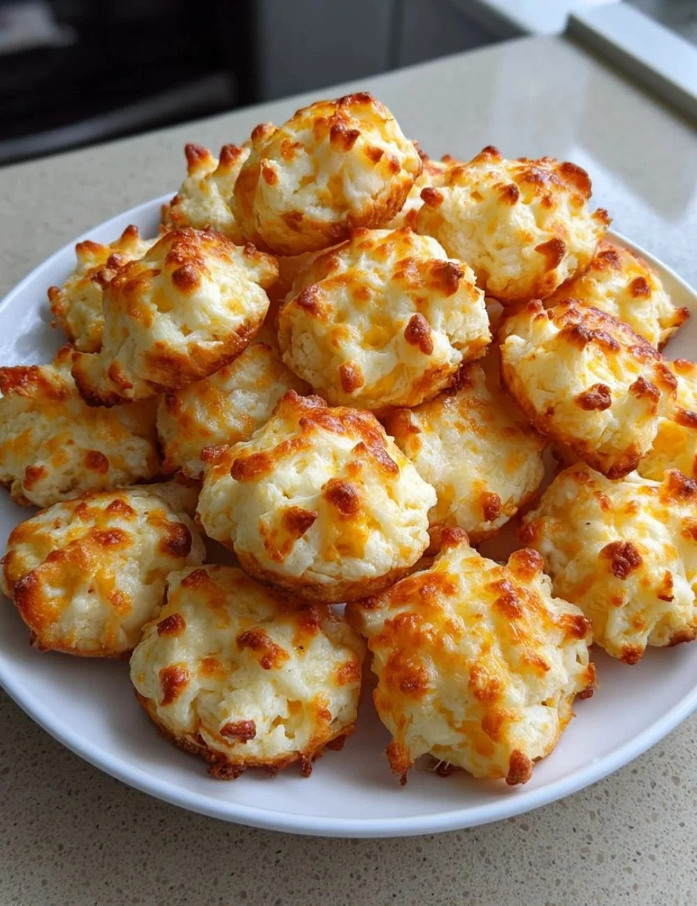 Delicious Southern cheese crackers served on a rustic wooden platter.