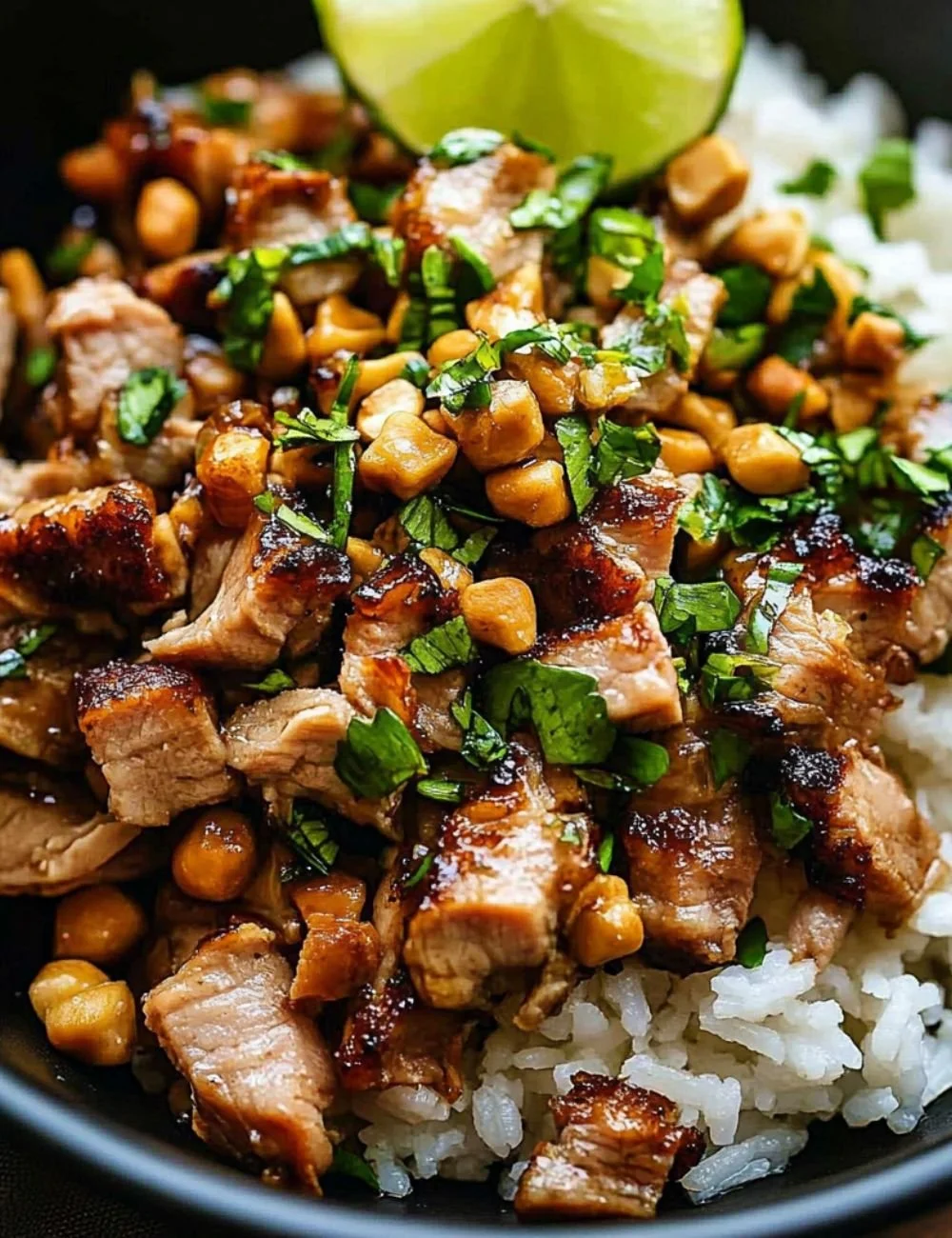 Ginger Lime Pork served with coconut rice on a modern plate