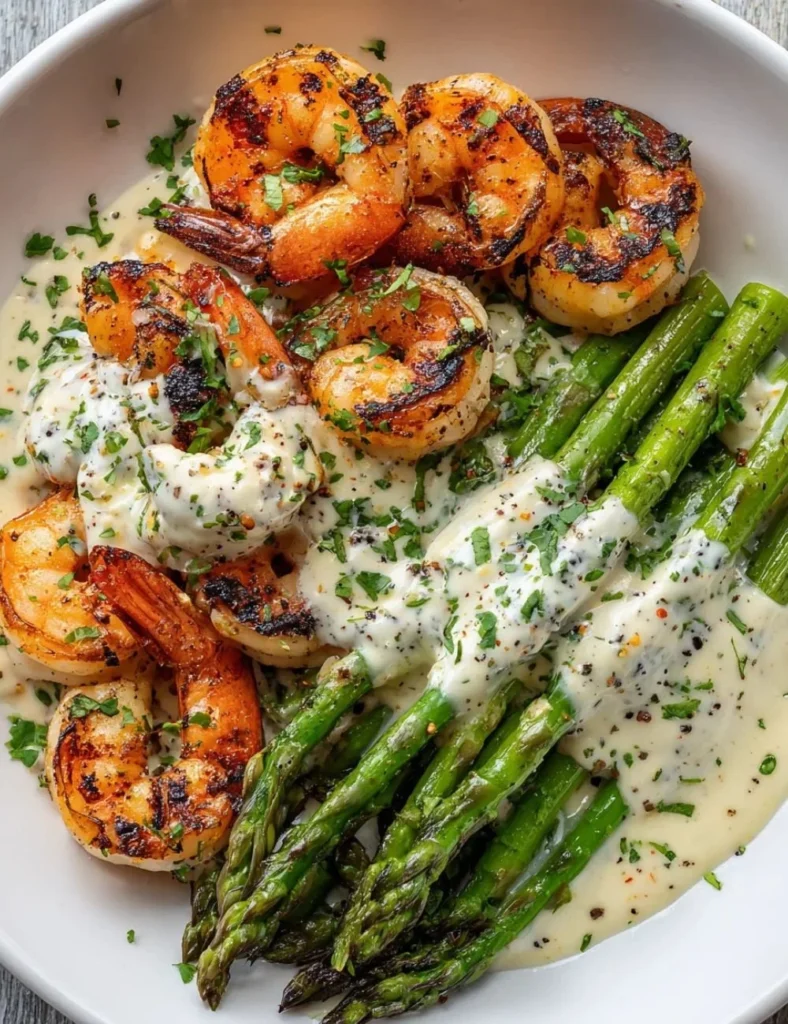 Grilled shrimp bowl topped with creamy asparagus garlic sauce