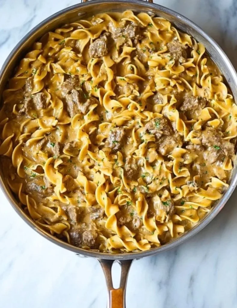 One Pot Beef Stroganoff served in a bowl with fresh parsley garnish