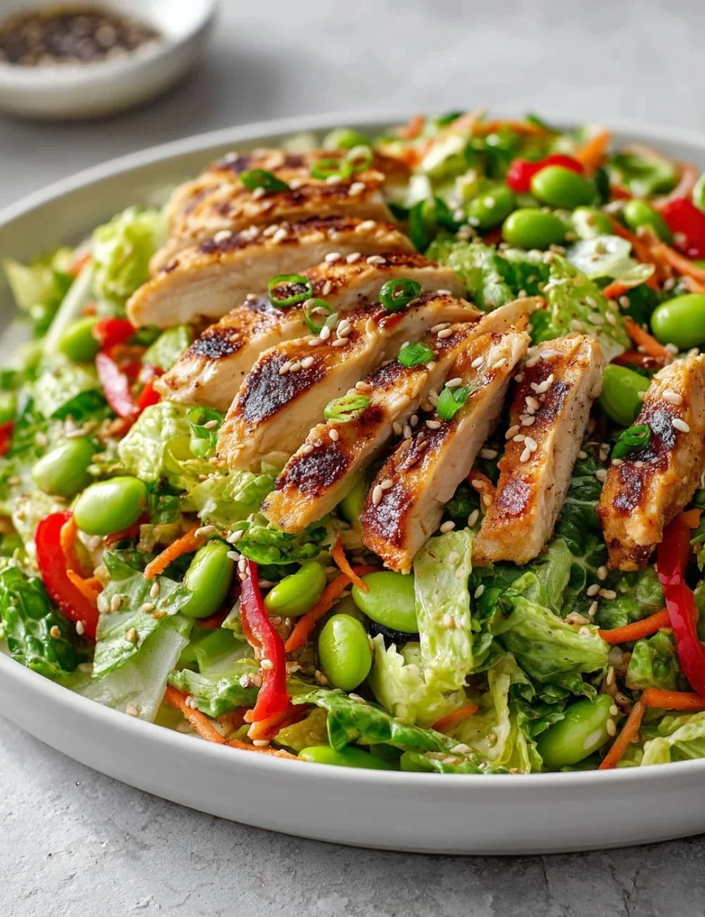 Fresh salad drizzled with homemade Asian dressing