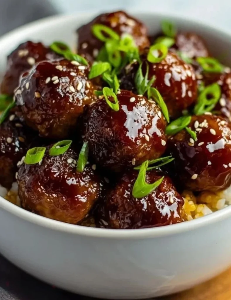 Delicious slow cooker teriyaki meatballs served with rice and vegetables