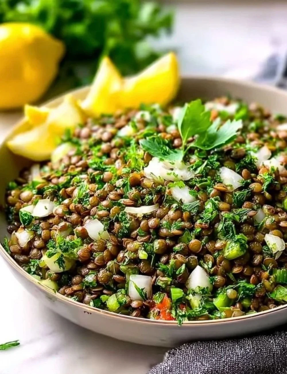 Bowl of Classic Lebanese Lentil Salad with fresh herbs and vegetables.