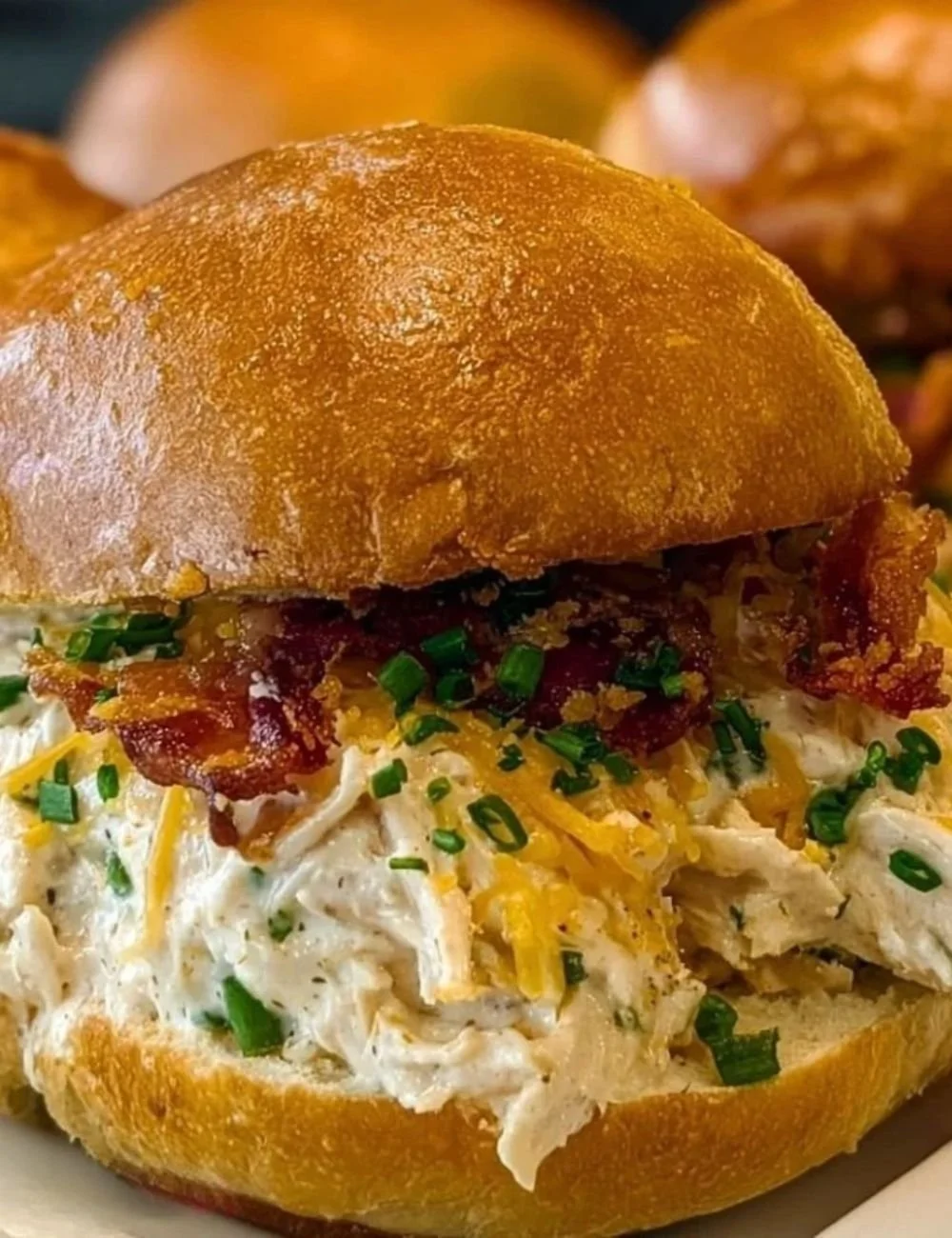 Delicious Crack Chicken Sandwich topped with herbs and served on a bun