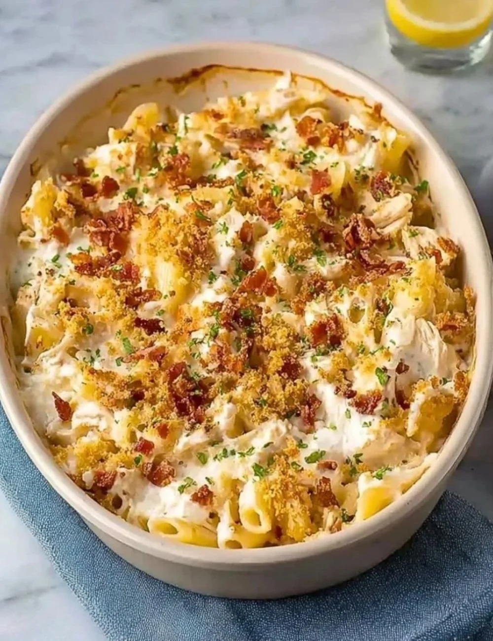 Easy Crack Chicken Casserole topped with cheese and herbs for a tasty meal