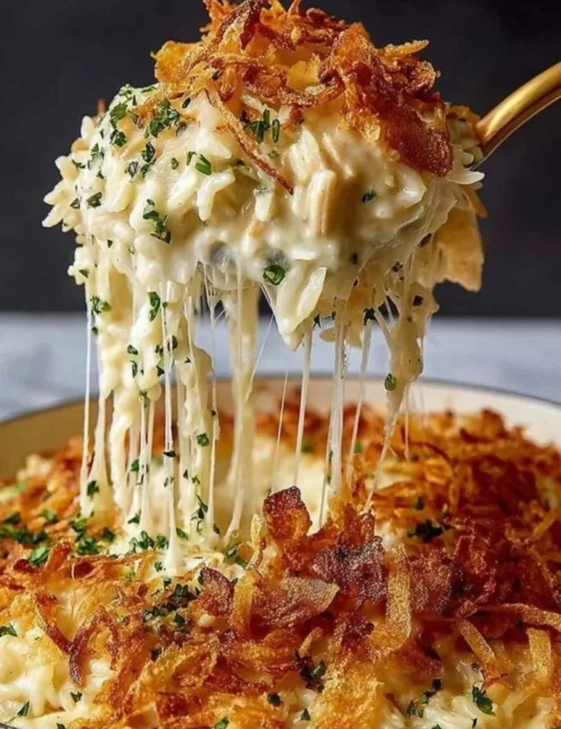 French onion chicken rice bake topped with melted cheese and herbs