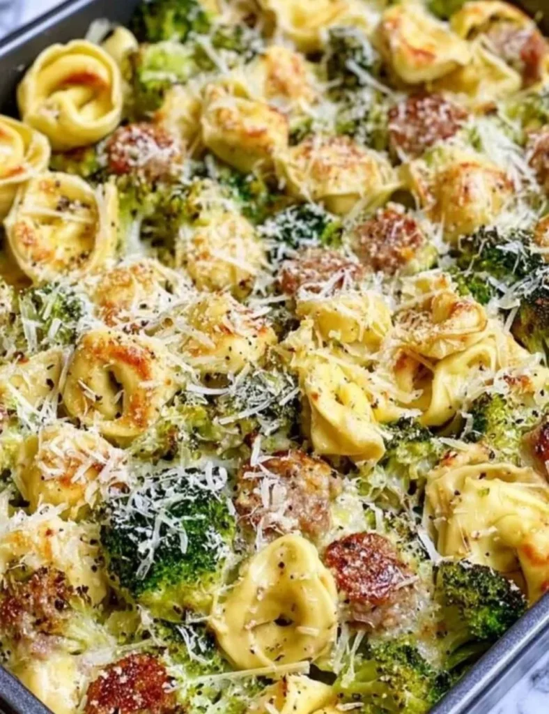 Sheet Pan Broccoli Tortellini Bake with fresh ingredients on a baking sheet
