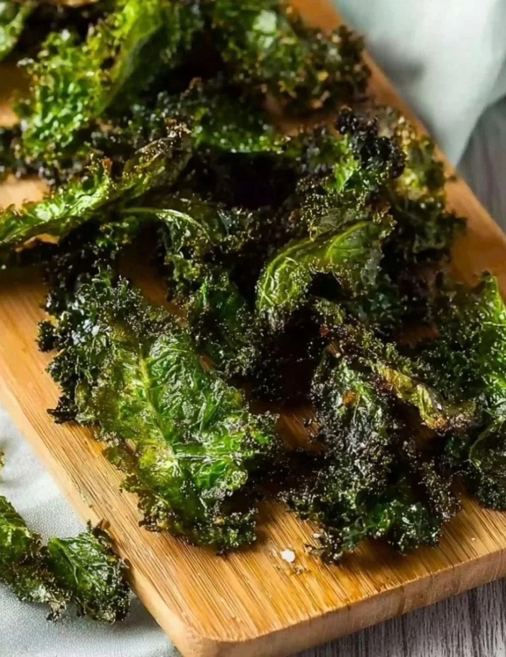 Bowl of homemade simple kale chips ready to be enjoyed as a healthy snack.