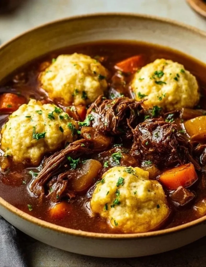 Slow Cooker Beef Stew with Dumplings in a serving bowl