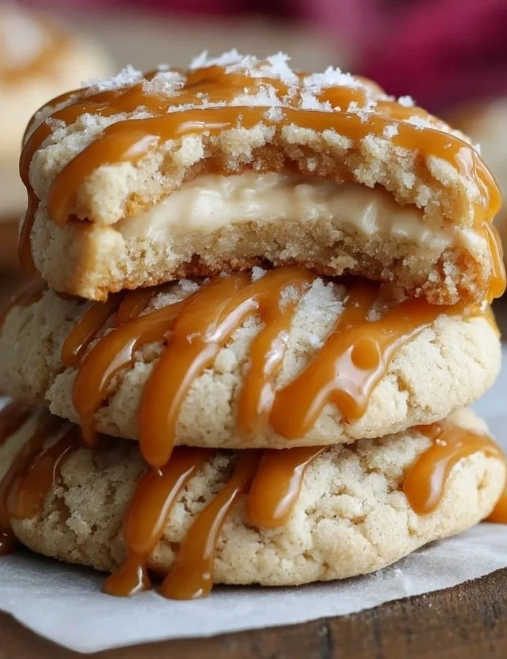 Homemade caramel cheesecake cookies topped with drizzled caramel.