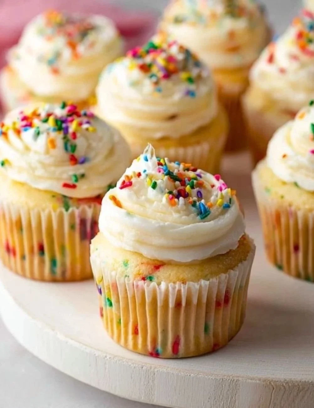 Delicious Funfetti-style cupcakes topped with colorful sprinkles.